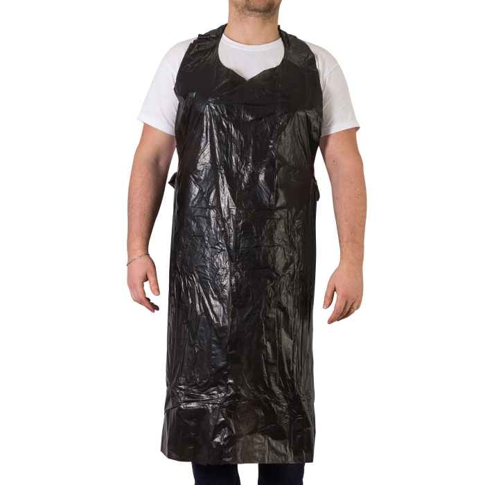 Man wearing a Killer Ink black disposable apron over white shirt and jeans